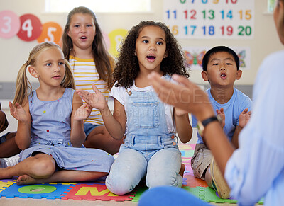 Buy stock photo Teacher, singing or kids in classroom learning a song together in preschool for voice development. Children daycare, vocal or young students in poem or musical performance in kindergarten creche