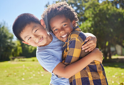Buy stock photo Portrait, children and friends hugging in a park together for fun, bonding or playing in summer. Hug, kids and diversity with boy best friends embracing in a garden in the day during school holidays