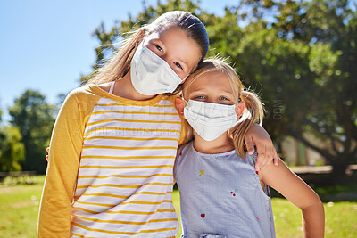 Buy stock photo Portrait, mask and friends hug, outdoor while bonding, loving together and relax. Kids, young girl and student children embrace and cover faces outside at park or garden in covid pandemic at school
