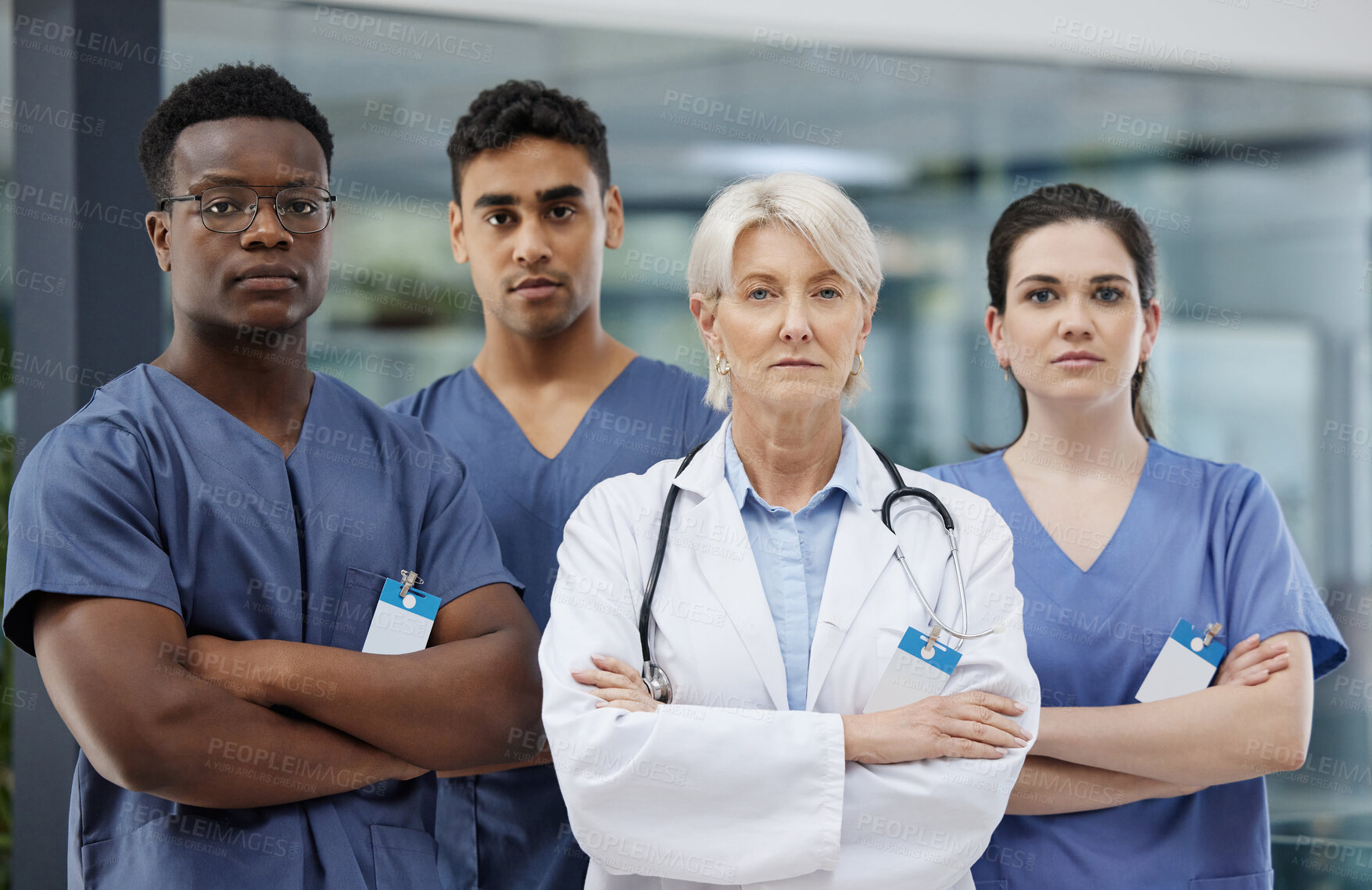 Buy stock photo Crossed arms, serious and portrait of doctors in hospital with confidence for medical career. Pride, teamwork and surgeon mentor with healthcare interns for university practical education in clinic.