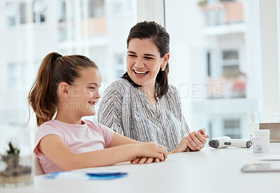 Buy stock photo Shot of a mother and daughter at a checkup at a hospital