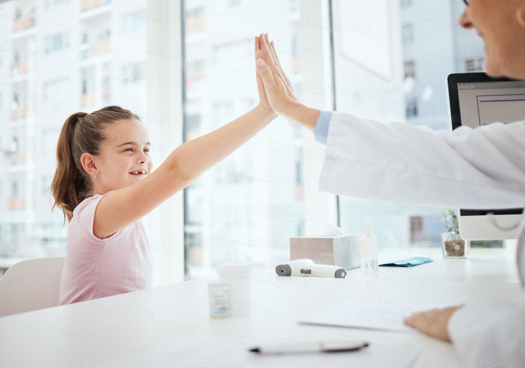 Buy stock photo Happy, doctor and high five with girl at office for consultation, checkup and good news. People, pediatrician and patient with smile or satisfied at clinic for healthcare, support and care or trust