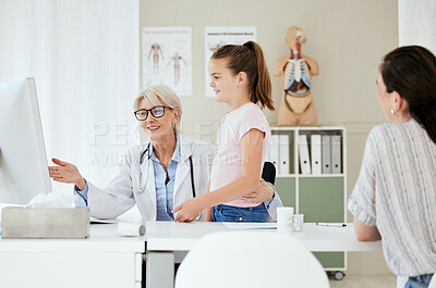 Buy stock photo Shot of a mature female doctor having a checkup with a patient at a hospital