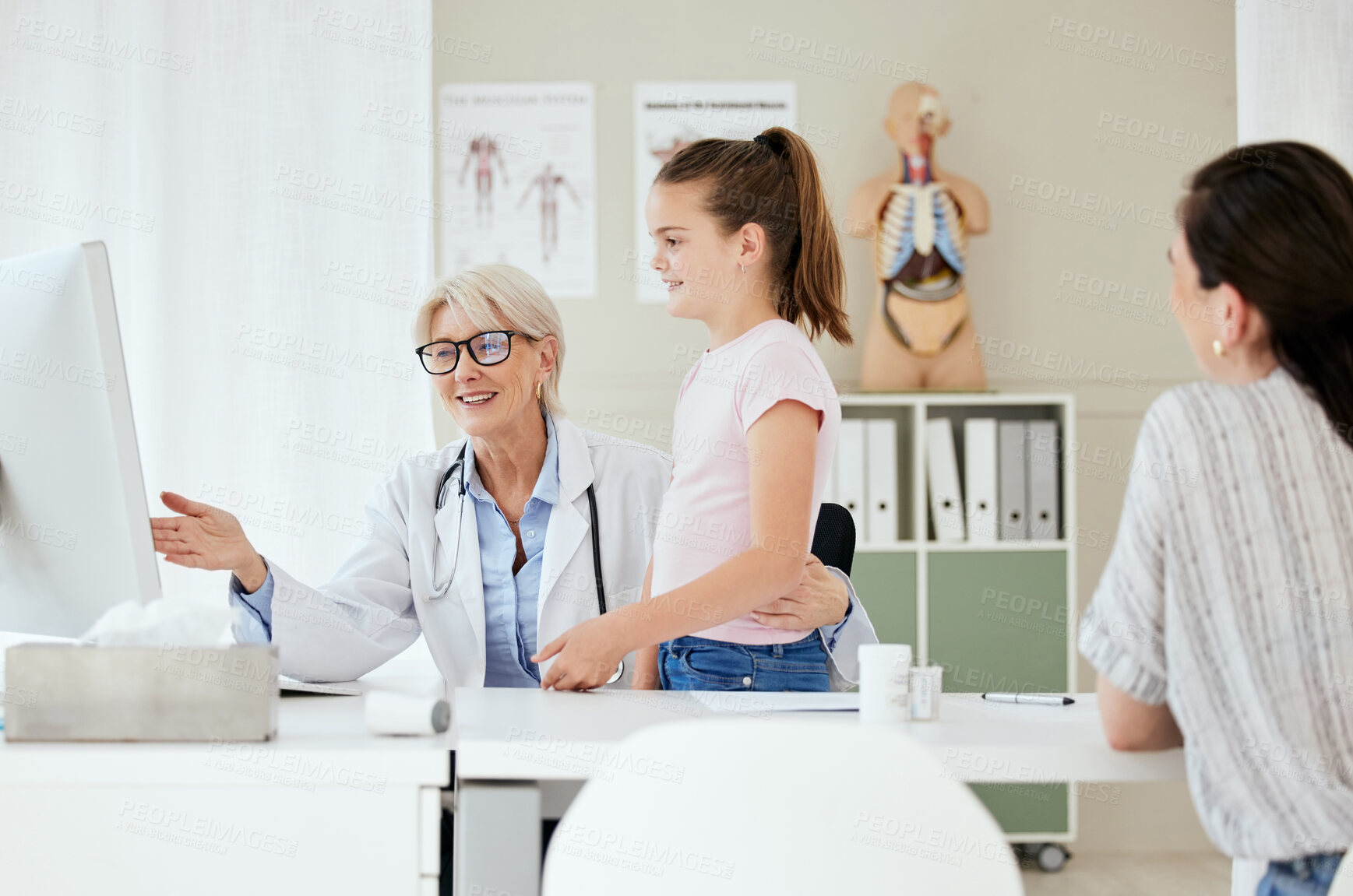 Buy stock photo Pediatrician, mom and child with computer for results, medical diagnosis or good news. Happy kid, parent and girl patient in clinic consultation with mature healthcare doctor and family in hospital