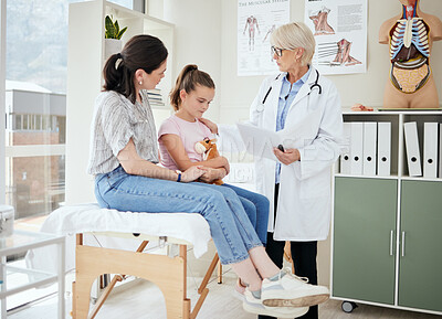 Buy stock photo Shot of a mature female doctor talking to a patient at a hospital
