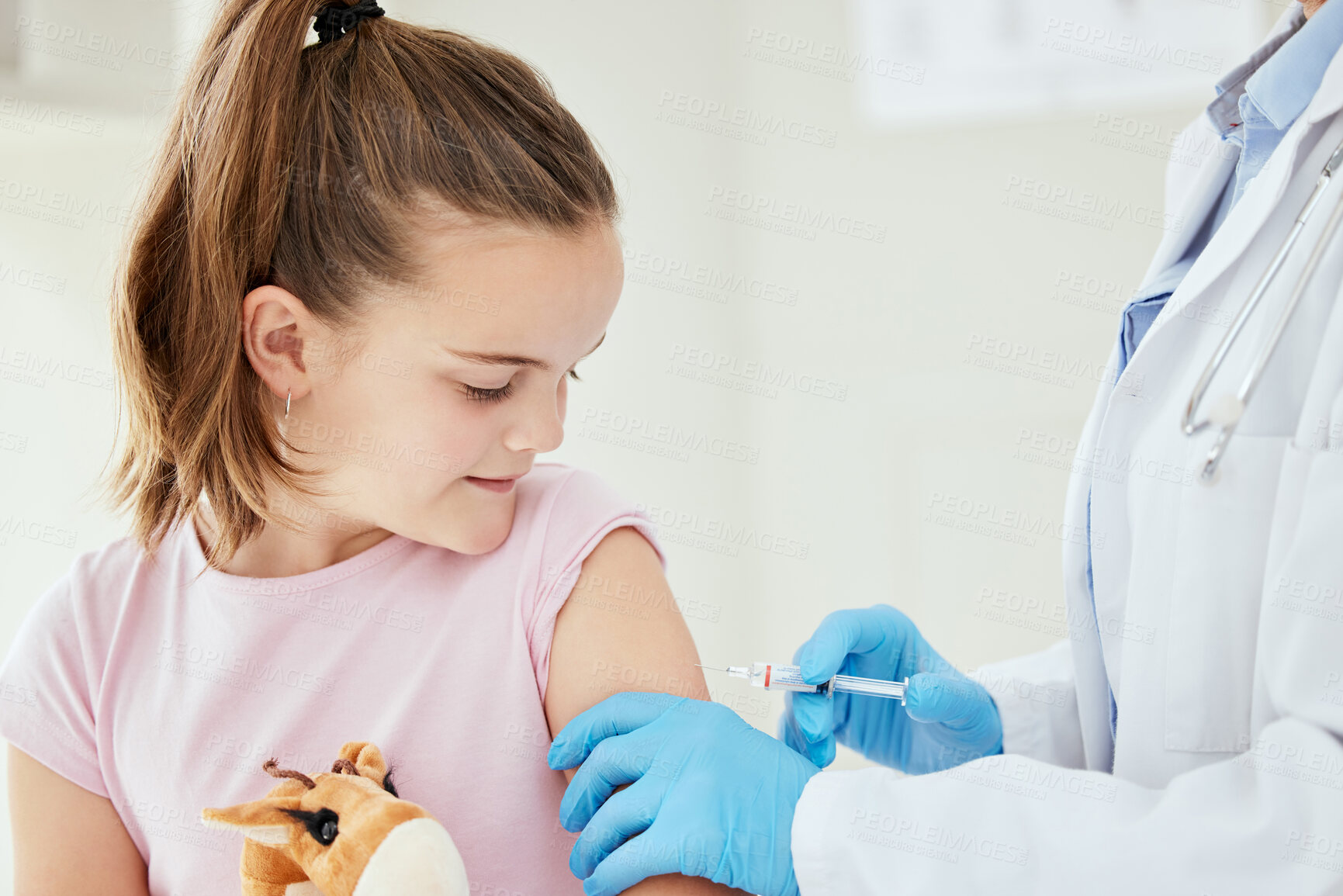 Buy stock photo Hands, girl and happy with injection as patient at clinic for immunization or vaccine for virus. People, doctor and kid with smile for needle or flu shot as prevention for disease and pandemic 