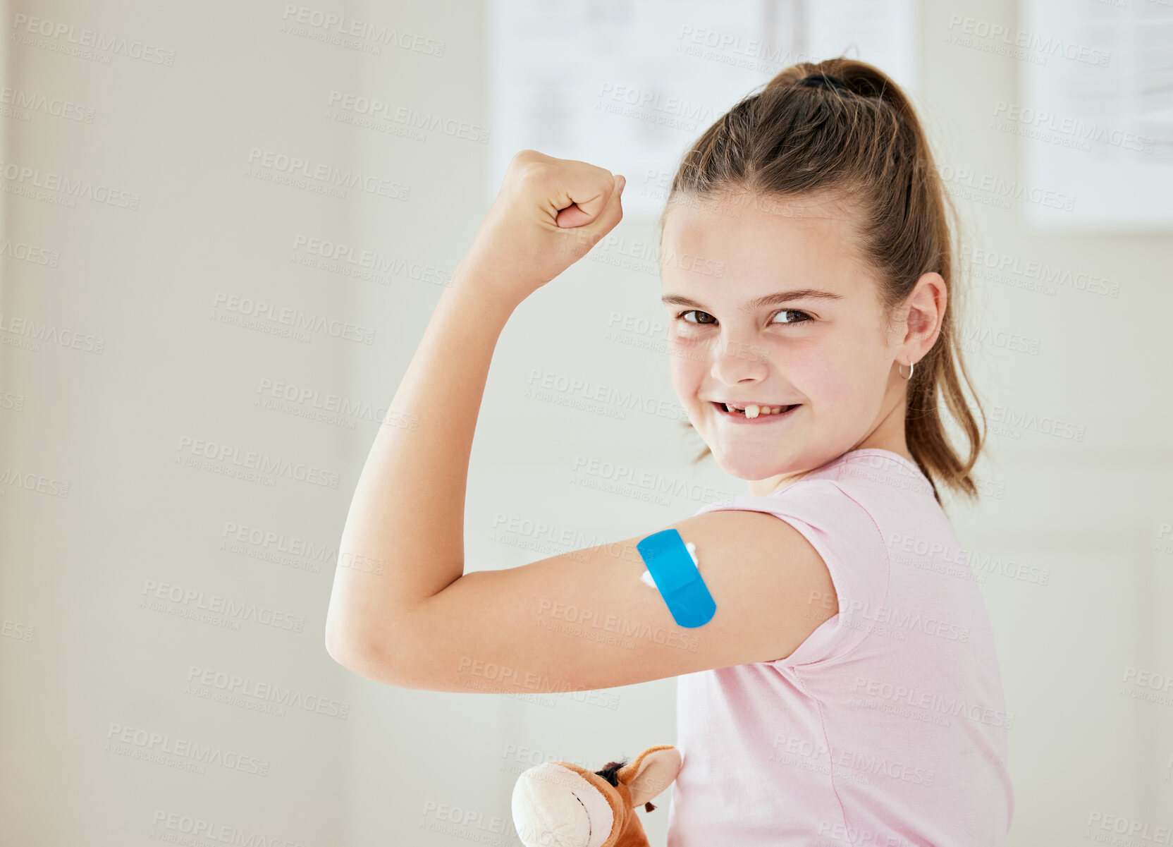 Buy stock photo Girl, kid and hospital plaster in portrait, vaccine injection and bandage for virus treatment. Female person with bicep flex for immunization booster, clinic and flu shot for empowerment