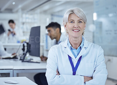 Buy stock photo Shot of a proud mature female scientist in the lab