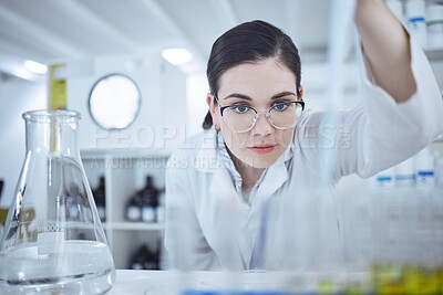 Buy stock photo Shot of a young female scientist testing samples