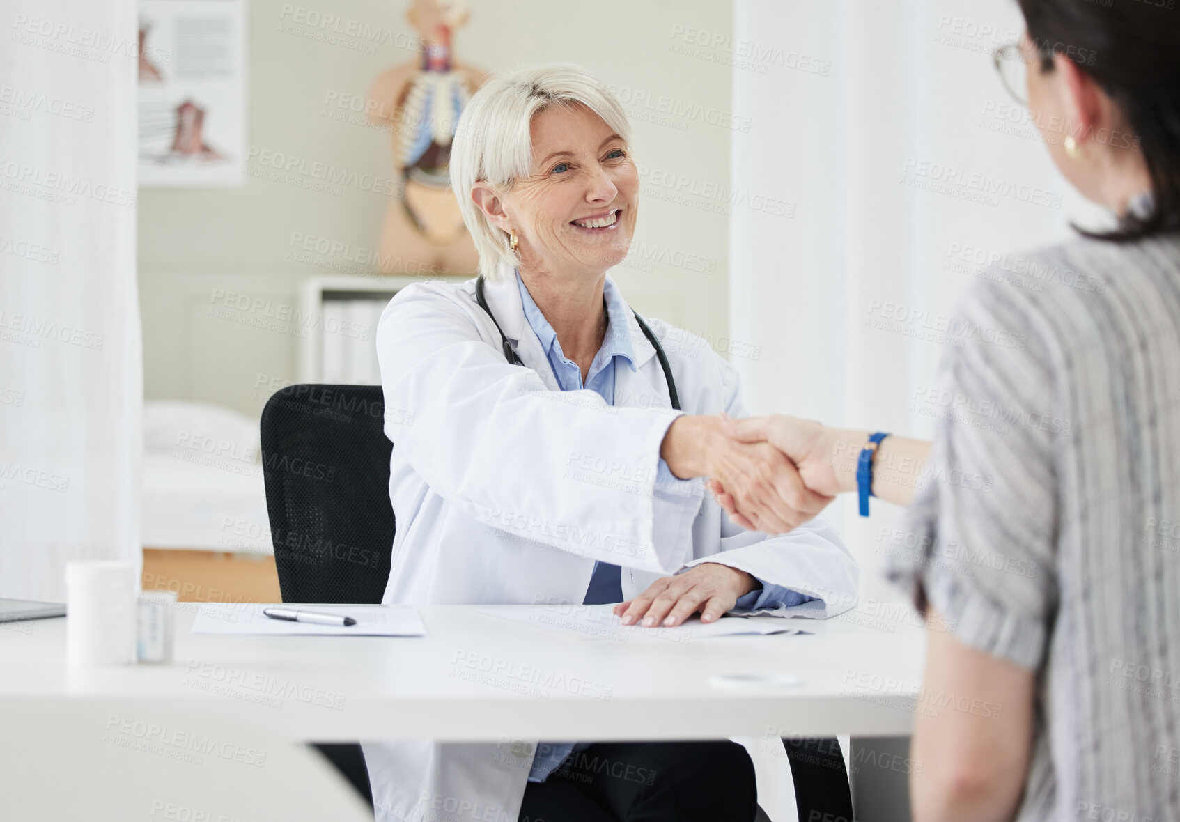 Buy stock photo Women, doctor and patient with handshake at office for welcome or greeting at consultation. People, medical professional and smile at clinic or hospital with good news on checkup for healthcare