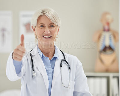 Buy stock photo Shot of a mature doctor giving the the thumbs up