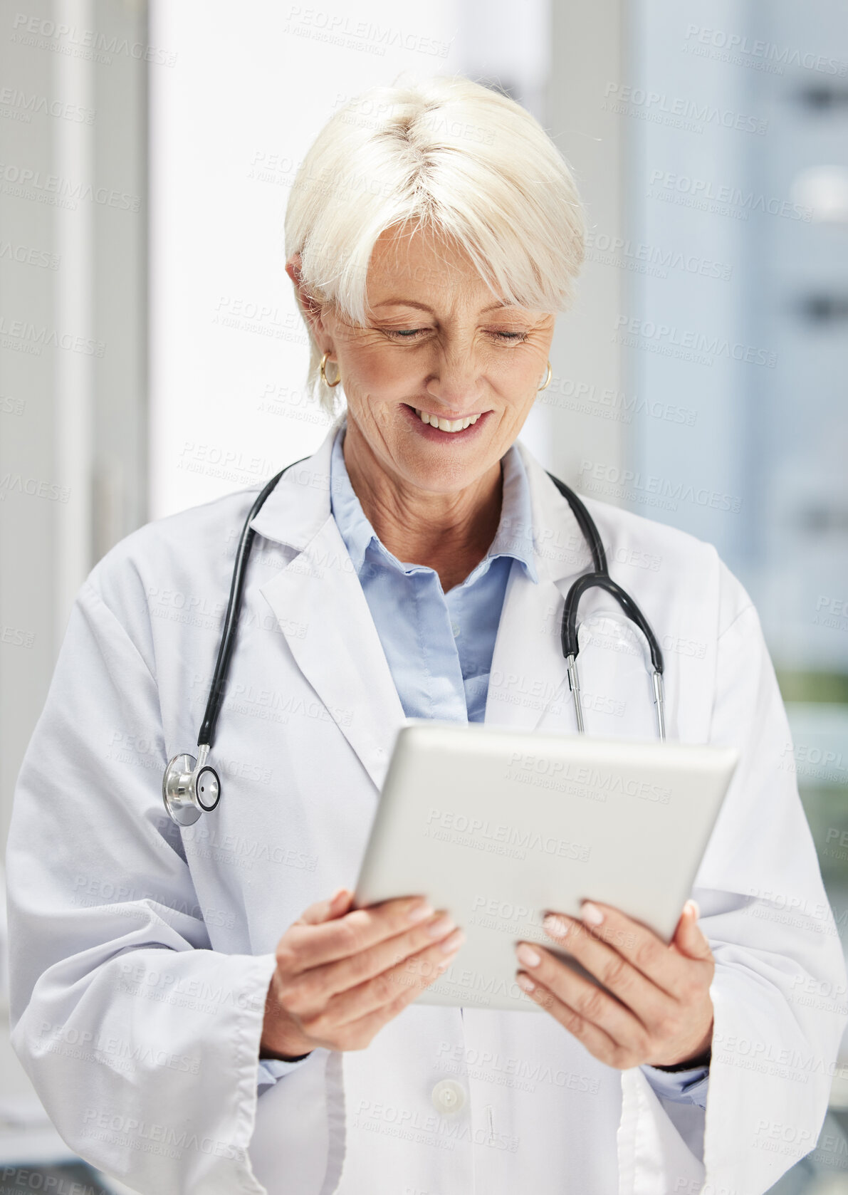 Buy stock photo Thinking, doctor and woman research on tablet, online wellness or telehealth in hospital. Happy medical worker smile, technology and scroll on digital website, healthcare app or reading email