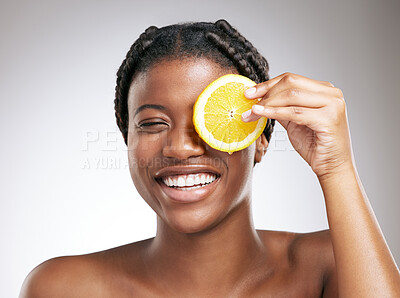 Buy stock photo Beauty, skincare and lemon with face of black woman in studio for cosmetics, vitamin c and facial. Self care, glow and organic treatment with person on white background for clean, natural and spa