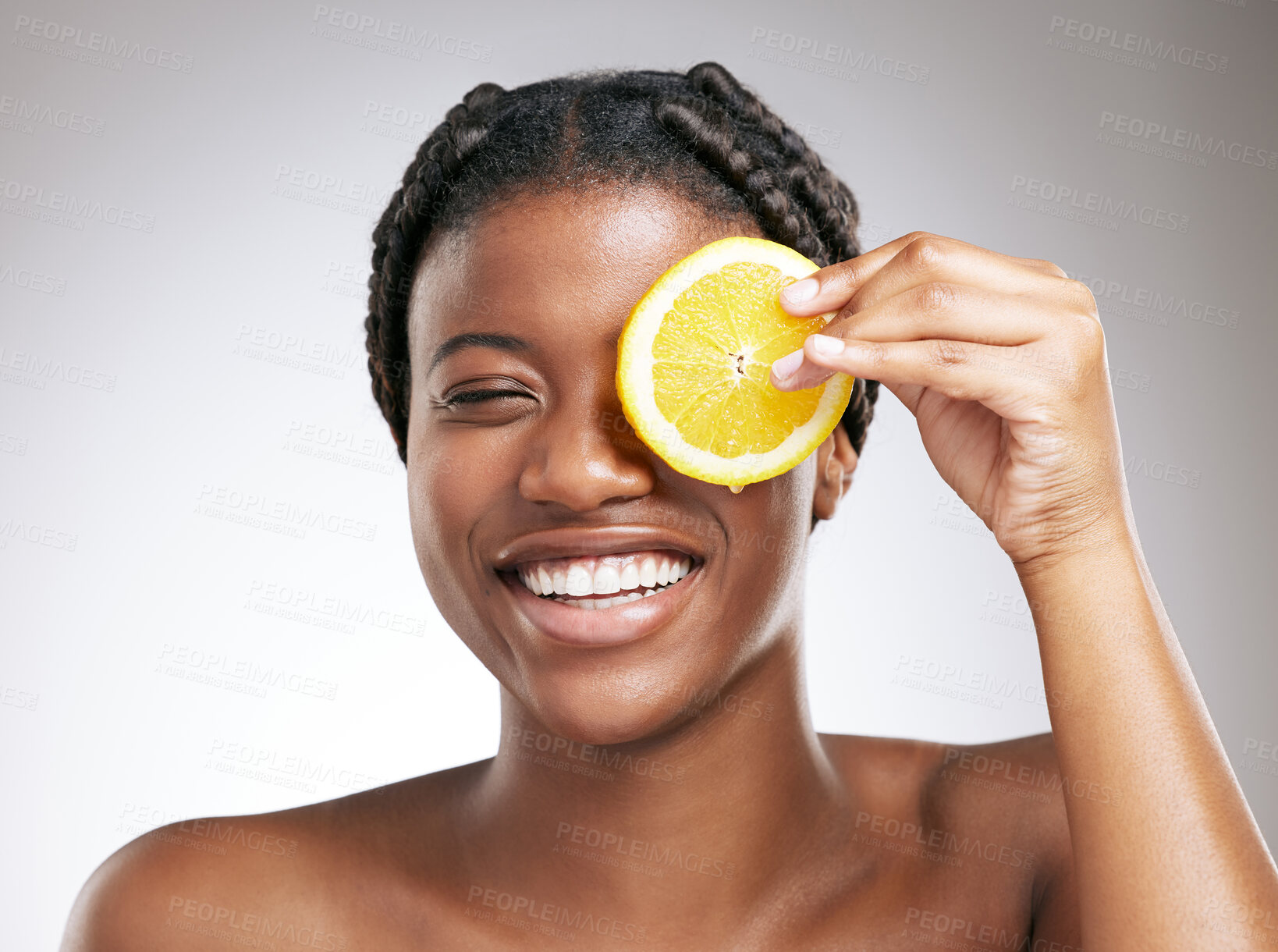 Buy stock photo Beauty, skincare and lemon with face of black woman in studio for cosmetics, vitamin c and facial. Self care, glow and organic treatment with person on white background for clean, natural and spa