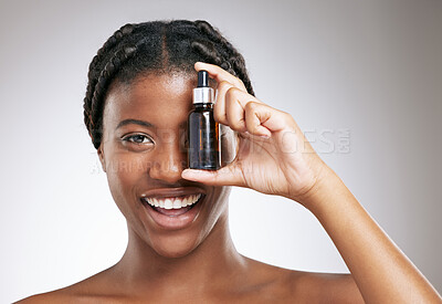 Buy stock photo Luxury, skincare and serum with portrait of black woman in studio for cosmetics, peptides and facial. Self care, glow and beauty extract with person on white background for clean, product and spa