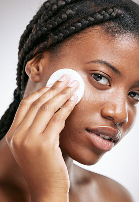 Buy stock photo Glow, skincare and cotton with portrait of black woman in studio for cosmetics, toner and facial. Self care, beauty and shine with female model on white background for clean, makeup remover and spa