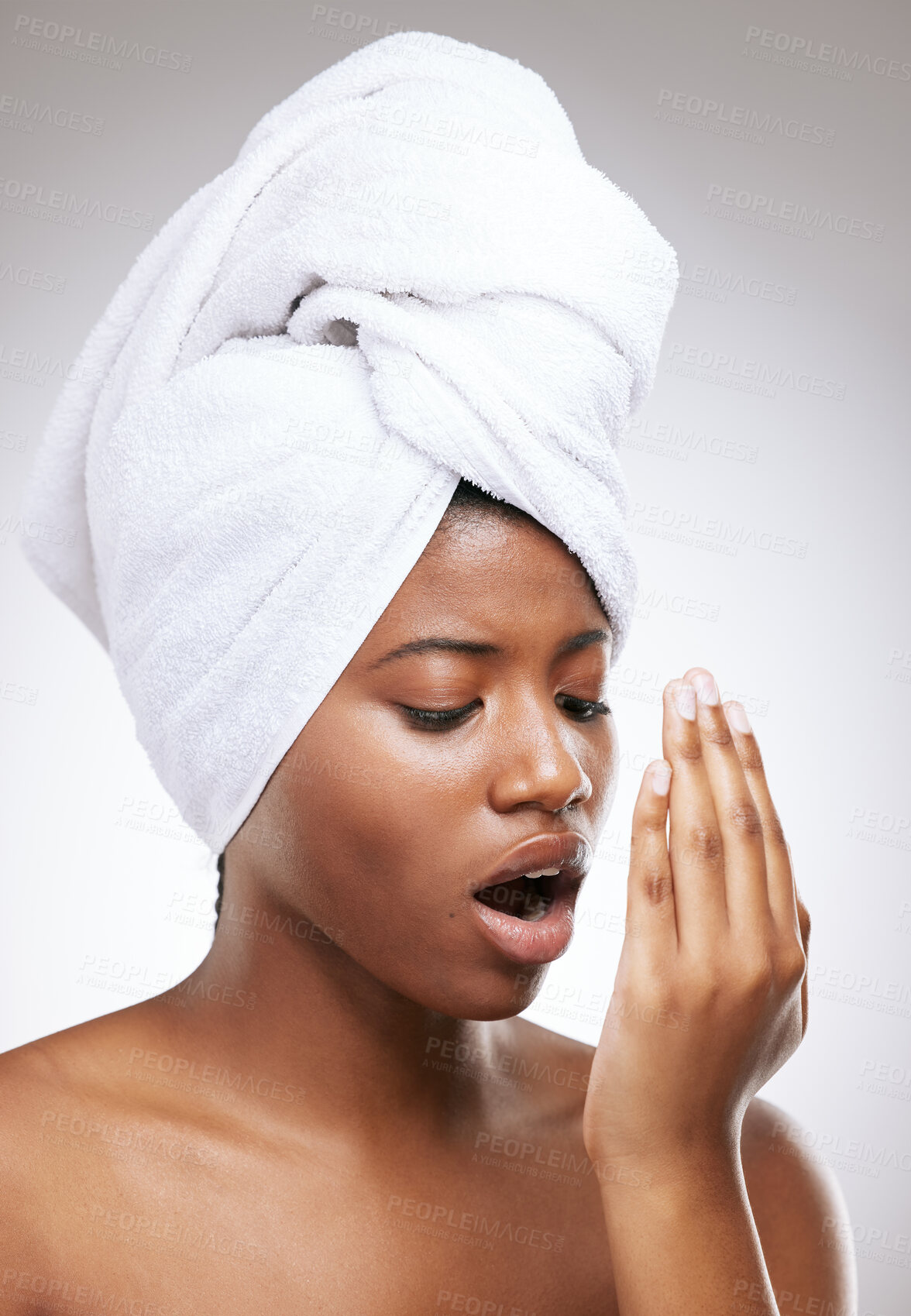 Buy stock photo Breath, check and black woman with hand on a white background for oral care, dental hygiene and fresh smell. Mouth, towel and isolated person with odor for wellness, health or clean in studio