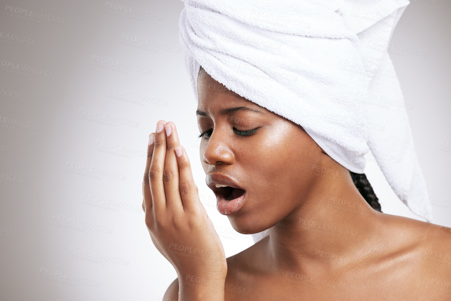 Buy stock photo Breath, check and black woman with hand in studio for oral care, dental hygiene and fresh smell. Exhale, towel and isolated person with odor in mouth for wellness, health or clean on white background