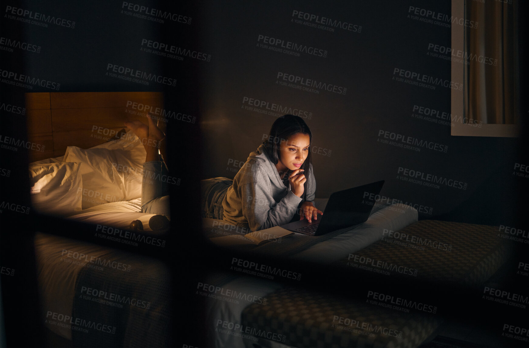 Buy stock photo Woman, laptop and reading at night for study, learning and university in home on bed with online course. Student, technology and notebook in apartment for college exam, education and research project