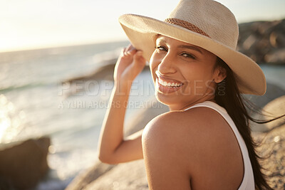 Buy stock photo Shot of a beautiful young woman spending time at the beach