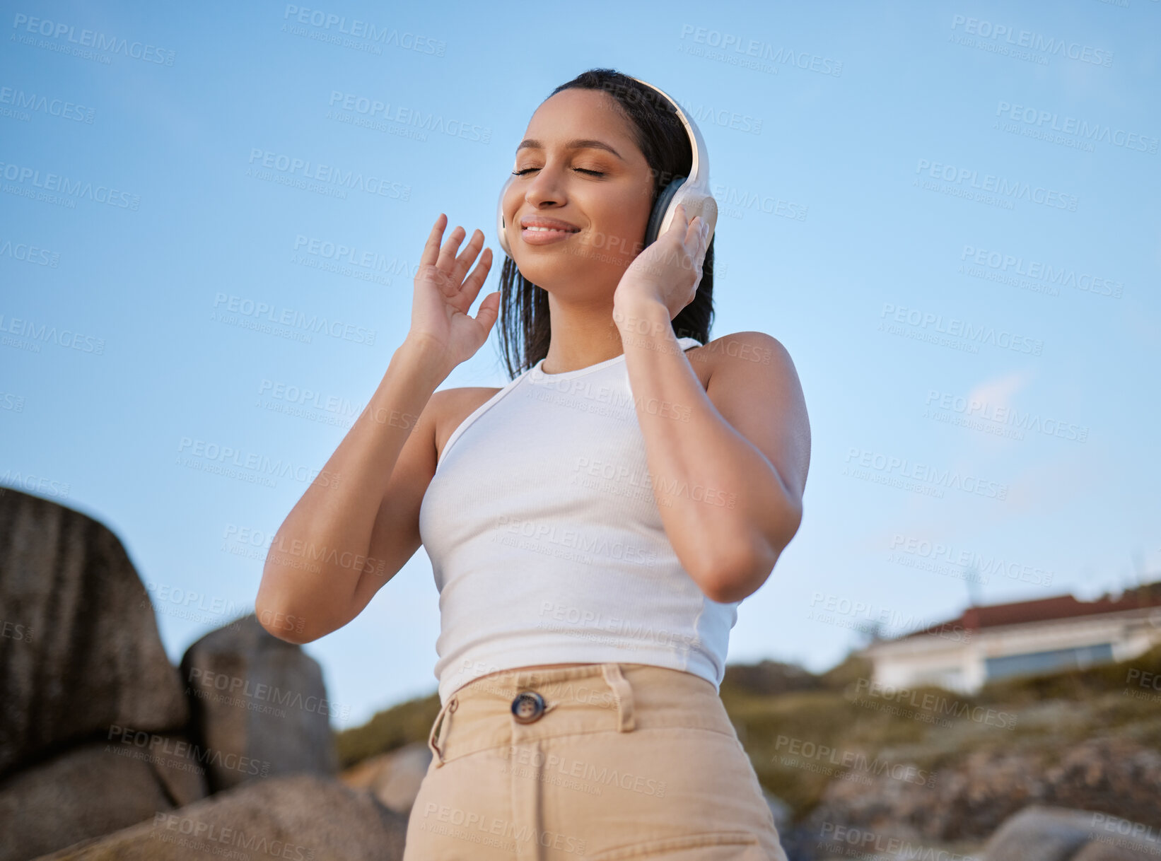 Buy stock photo Outdoor, woman and smile with eyes closed on headphones for music, audio and radio in Brazil. Female person, outside and happy or satisfied with streaming for motivational sound to relax on break