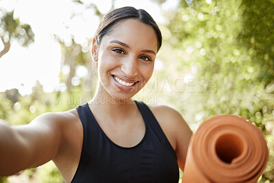 Buy stock photo Cropped portrait of an attractive young female athlete taking selfies while exercising outdoors