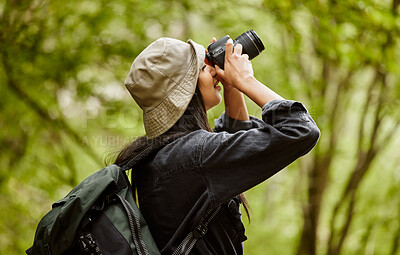 Buy stock photo Woman, photographer and camera to explore jungle, hiking and forest for travel journalism. Female person, trekking and capture memory of natural ecosystem, sightseeing and photography in Indonesia