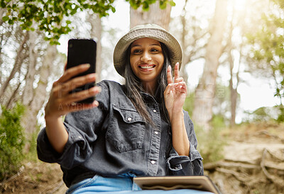 Buy stock photo Woman, peace sign and selfie in nature, hiking and forest for travel to Indonesia for blog. Female person, trekking and capture memory of jungle ecosystem, emoji and outdoor for trip to holiday