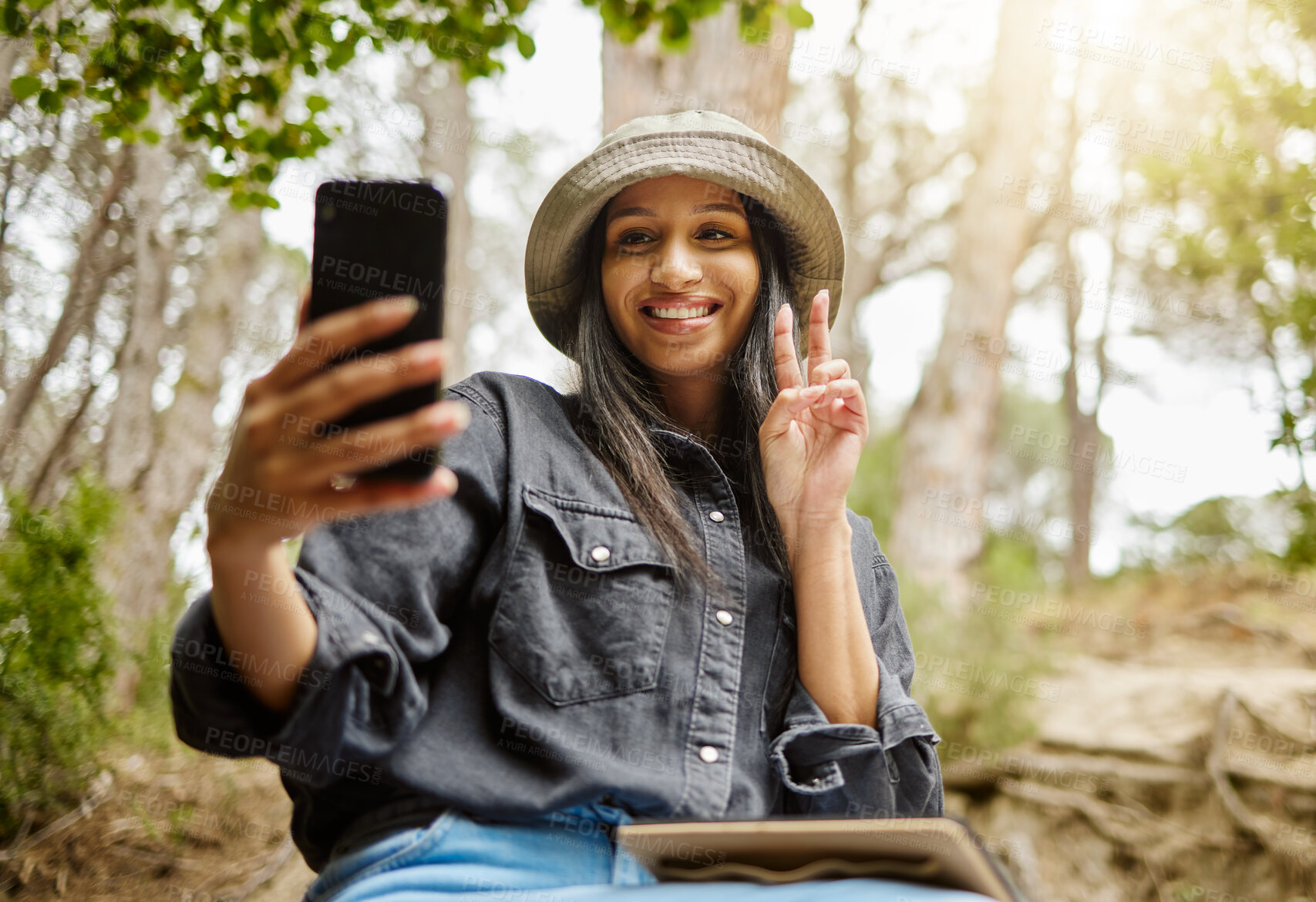 Buy stock photo Woman, peace sign and selfie in nature, hiking and forest for travel to Indonesia for blog. Female person, trekking and capture memory of jungle ecosystem, emoji and outdoor for trip to holiday