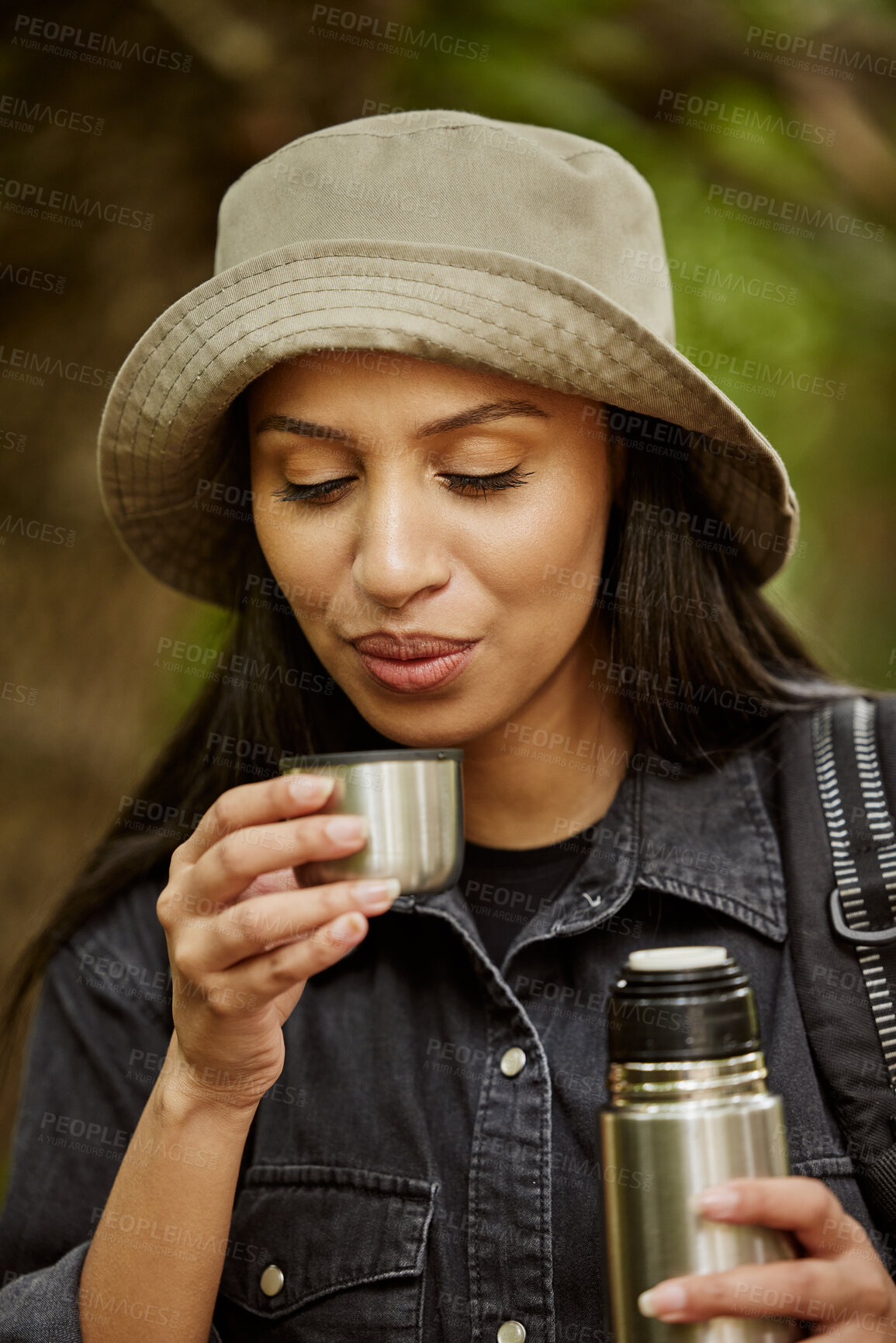 Buy stock photo Woman, hiker and cap with flask for coffee, drink or beverage on outdoor adventure or journey in nature. Young, female person or tourist with travel mug for caffeine, tea or liquid in forest or woods