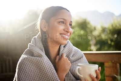 Buy stock photo Woman, thinking and coffee on balcony with blanket, vacation and happy for mental health. Girl, tea and relax on resort deck with smile, comfort and peace with nature view at luxury accommodation