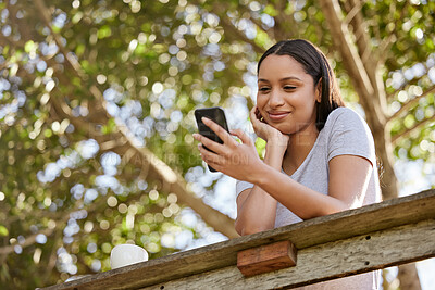 Buy stock photo Nature, holiday and woman with phone on balcony for hospitality, information and location update. Peace, relax and female person with tech by forest for website of vacation accommodation in Thailand