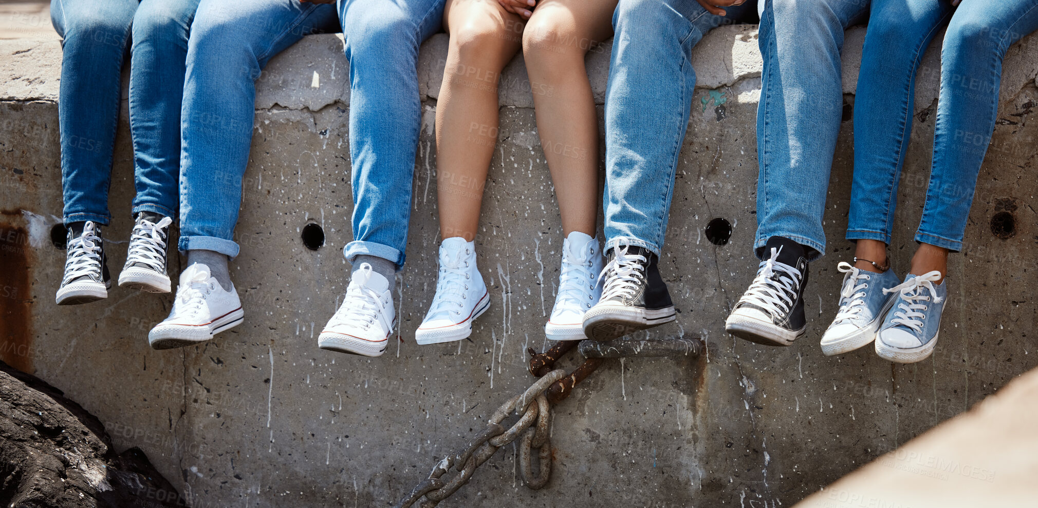 Buy stock photo People, legs and relax on dock for travel, journey break and comfort with sneakers. Friends, feet or rest on harbor for summer vacation, student holiday or enjoy sunshine on pier for social gathering