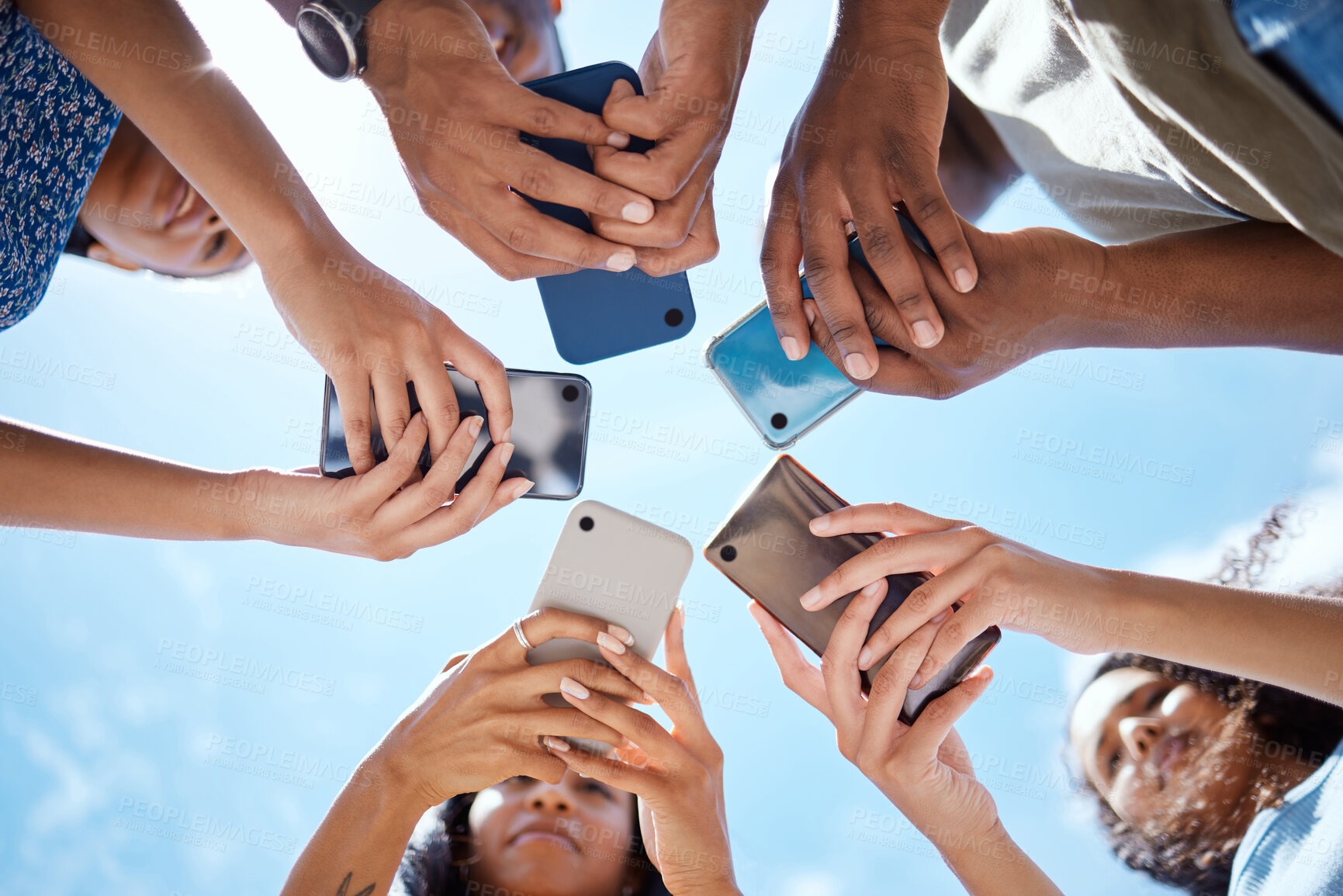 Buy stock photo People, hands and outdoor circle of phones for networking, online communication and blue sky. Friends, huddle and share news or search for connection on internet, social media support and low angle