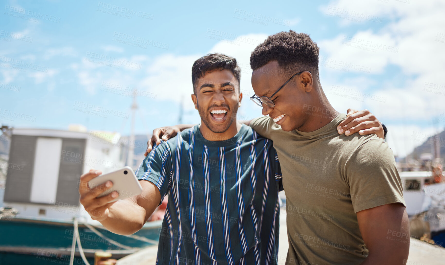 Buy stock photo Happy, men and laughing with selfie at harbour for outdoor adventure, update and memory of vacation. Friends, people and silly with digital photography at seaside for travel, content and holiday post