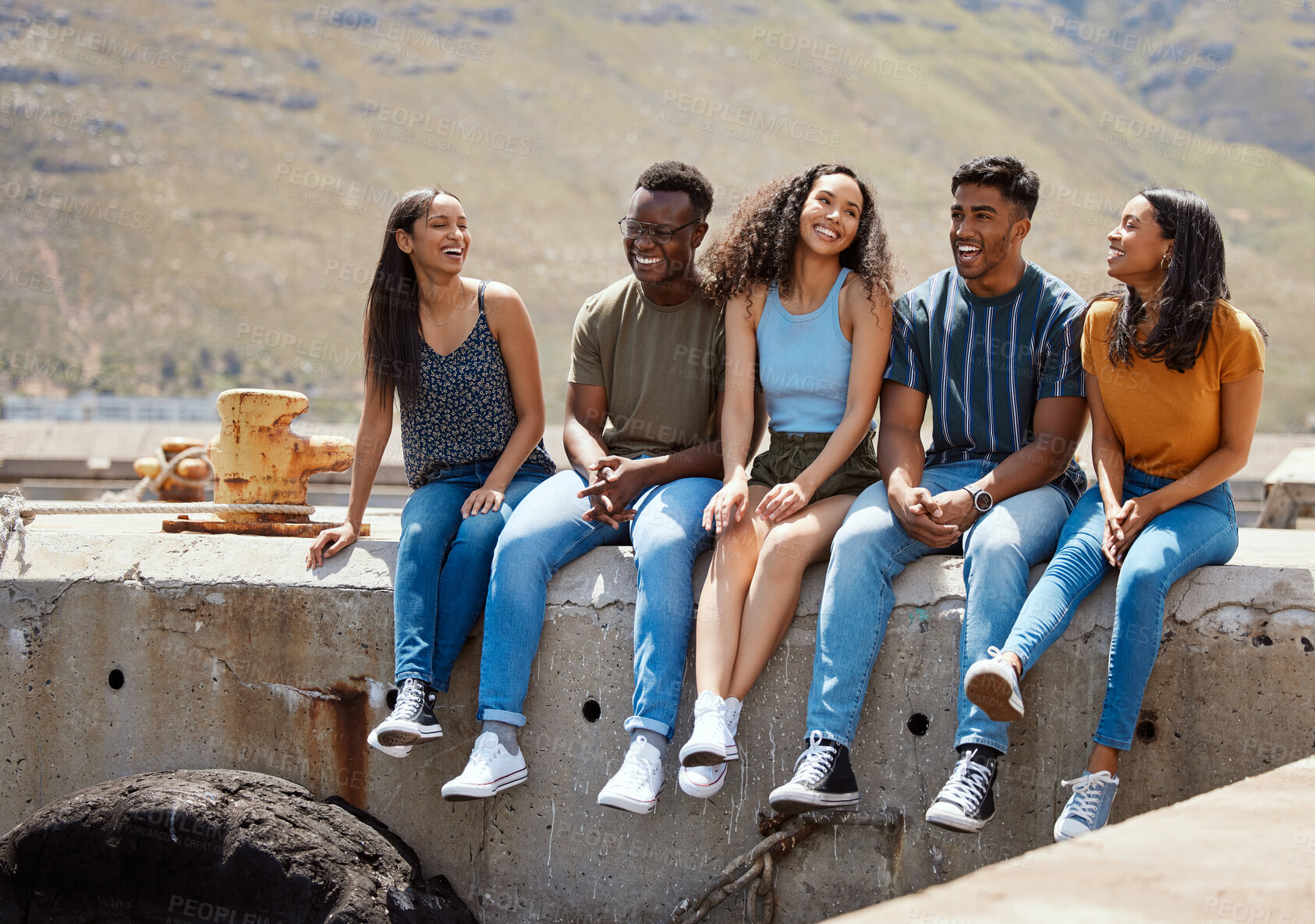 Buy stock photo People, laughing and outdoor vacation for talk, reunion and group together for bonding. Friends, diversity on weekend trip and funny conversation with hangout in Scotland, joke and pier on adventure