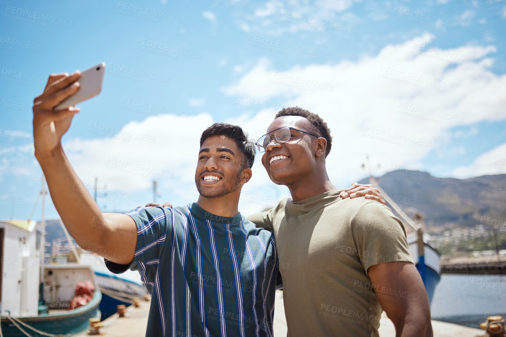 Buy stock photo Happy, men and smile with selfie at harbour for outdoor adventure, update and memory of holiday. Friends, people and blue sky with digital photography at seaside for travel, content and vacation post