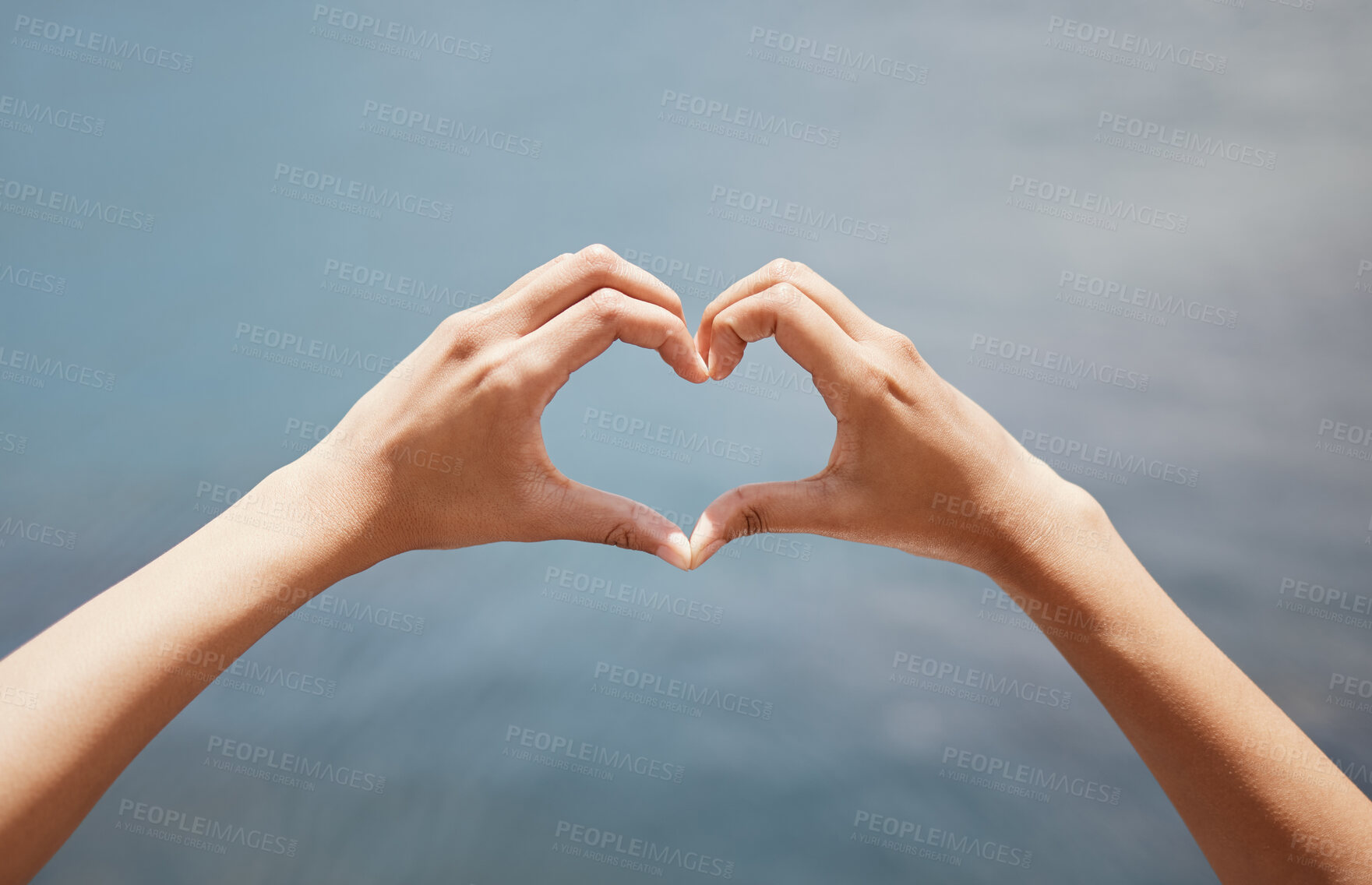 Buy stock photo Ocean, water and person with hands in heart shape for adventure, support and love of nature. Aqua, travel and gesture with emoji by liquid for holiday, connection and symbol of kindness on vacation