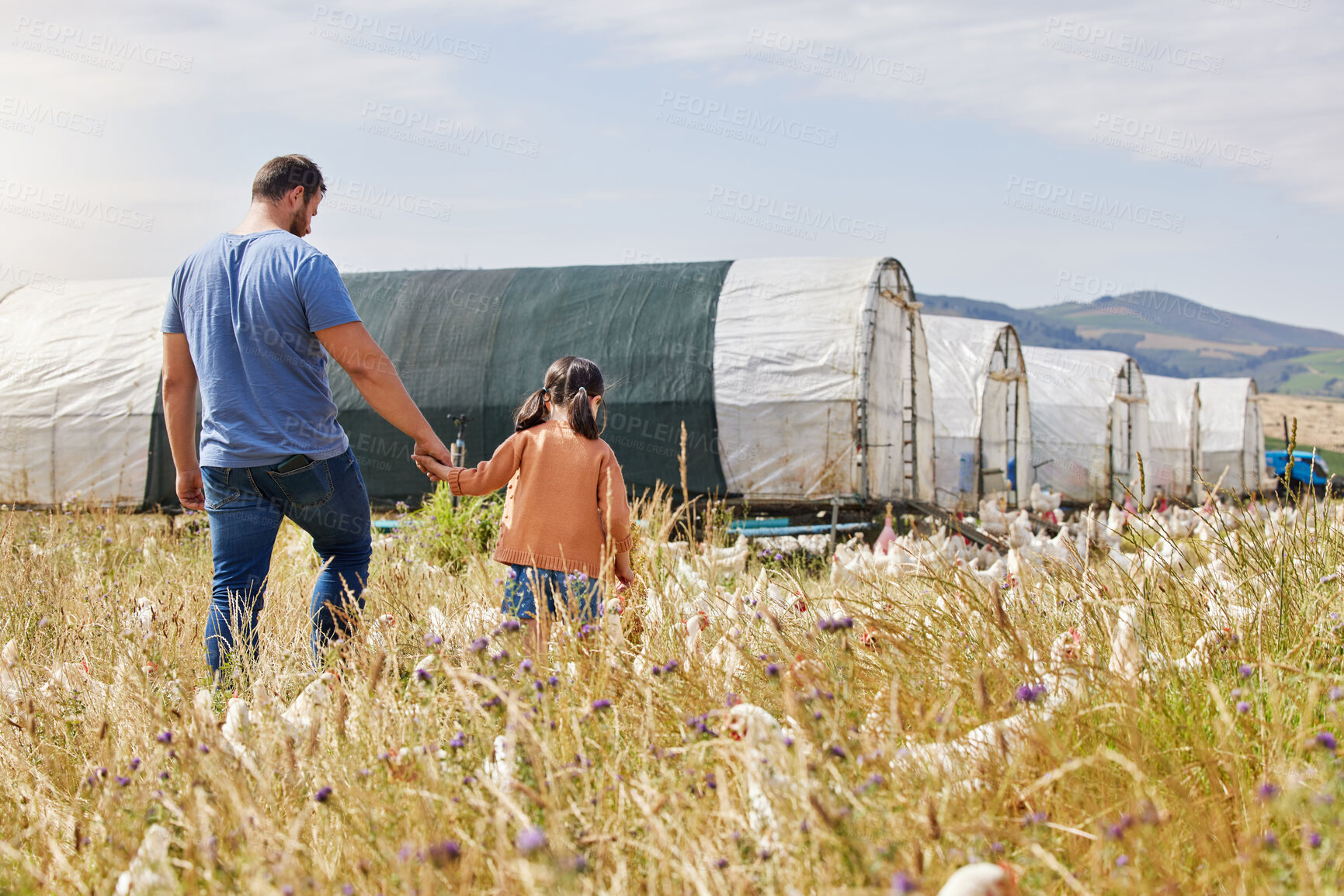 Buy stock photo Shot of a man and his daughter spending time together on their farm