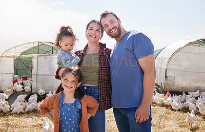 Buy stock photo Shot of a couple and their two daughters on a poultry farm