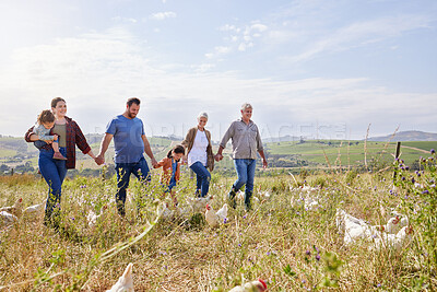 Buy stock photo Shot of a multi-generational family spending time together on a poultry farm