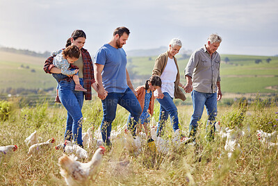 Buy stock photo Shot of a multi-generational family spending time together on a poultry farm