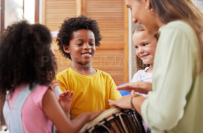 Buy stock photo Shot of a woman teaching her class about musical instruments