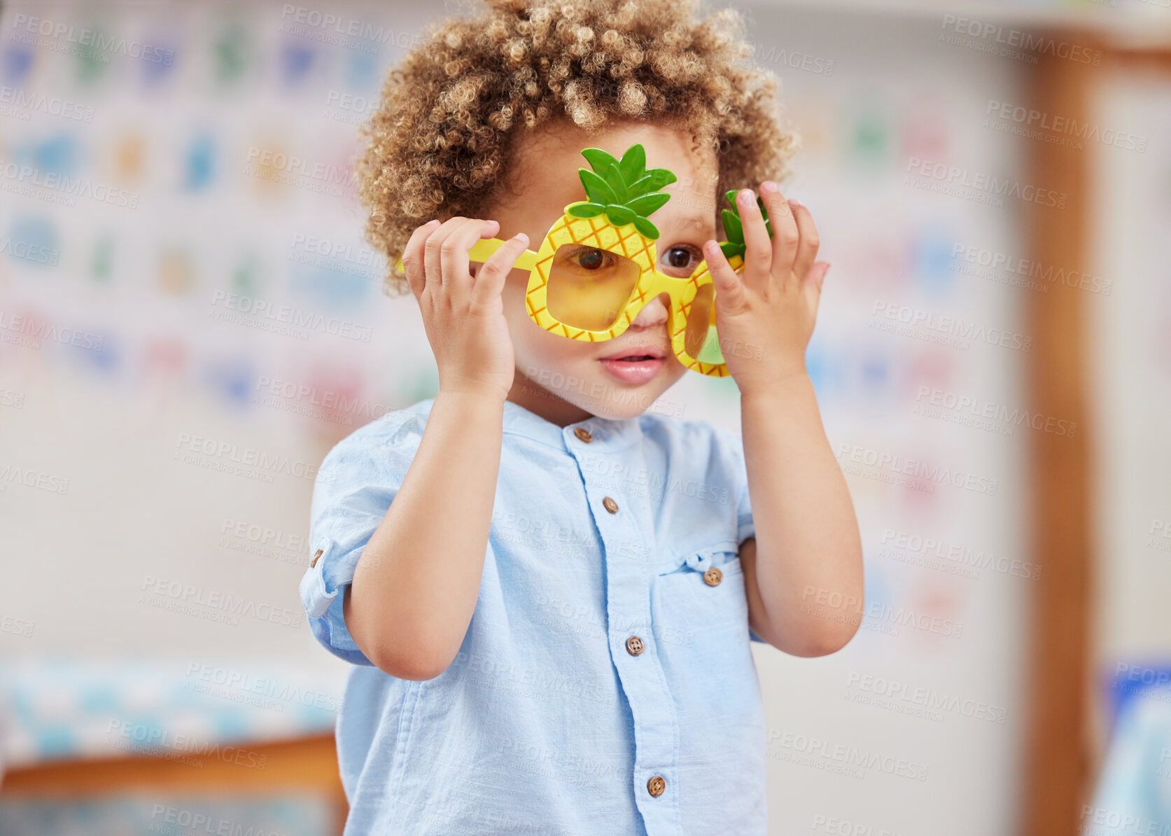 Buy stock photo Shot of a little boy wearing funky glasses in class