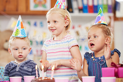 Buy stock photo Shot of a preschool children celebrating a birthday in class