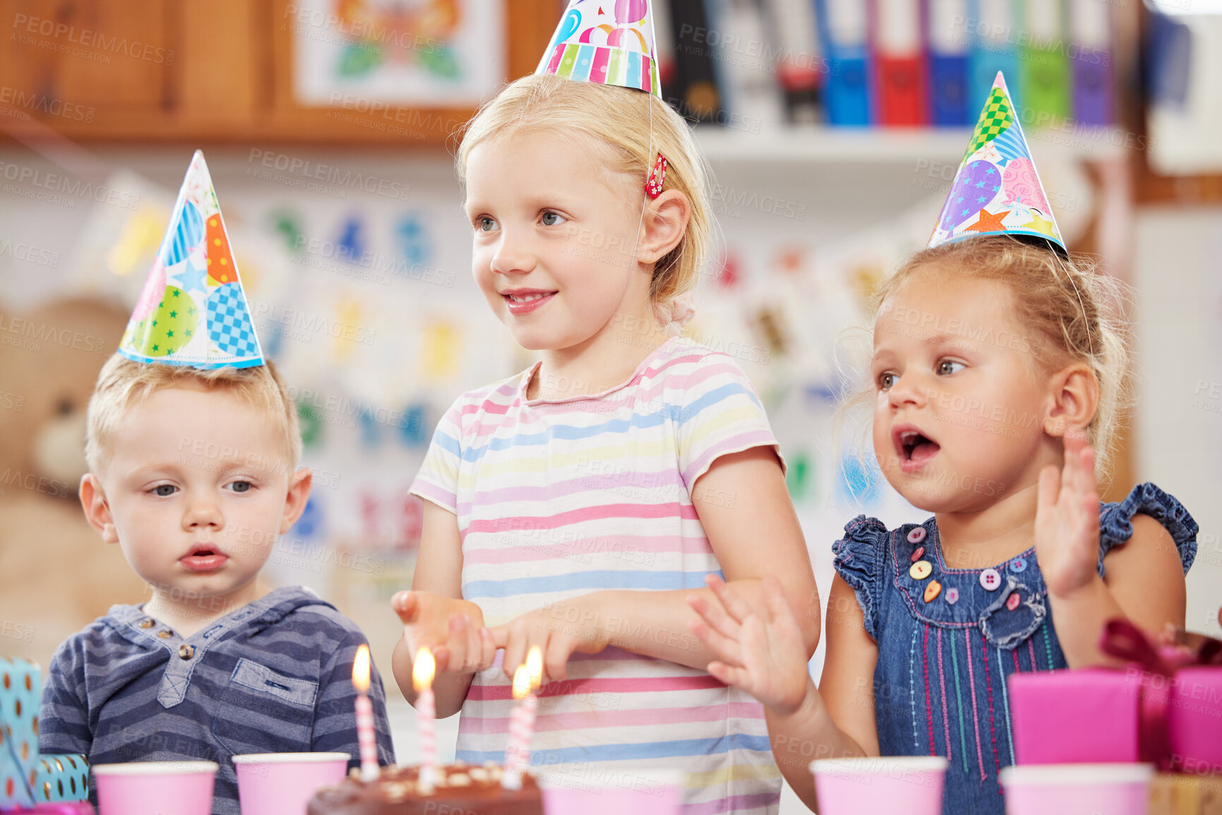 Buy stock photo Shot of a preschool children celebrating a birthday in class