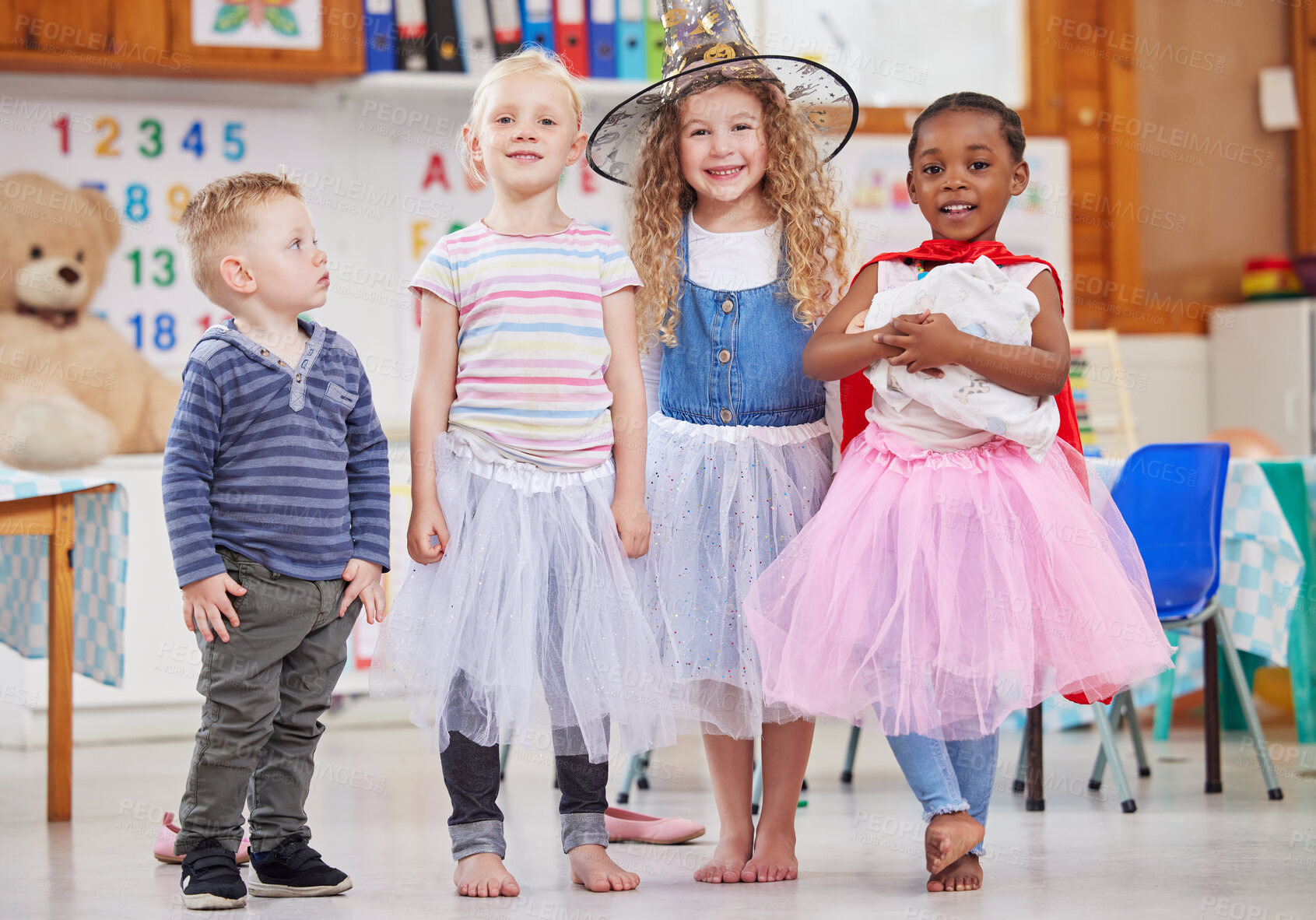 Buy stock photo Group, children and costume in classroom, party and portrait for celebration, excited and birthday. Kids, friends and diversity at event with hat, playful and smile for development at kindergarten