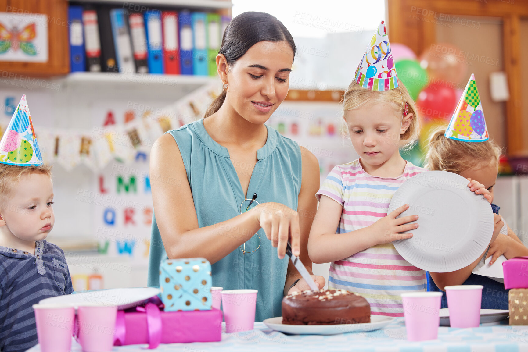 Buy stock photo Shot of a preschool children celebrating a birthday in class