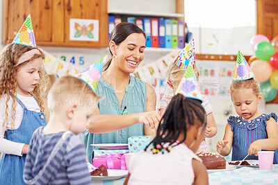 Buy stock photo Happy teacher, children and birthday cake in classroom, cutting and excited with snack at party. Kids, woman and helping hand with diversity, dessert and sweets at creche, school and kindergarten