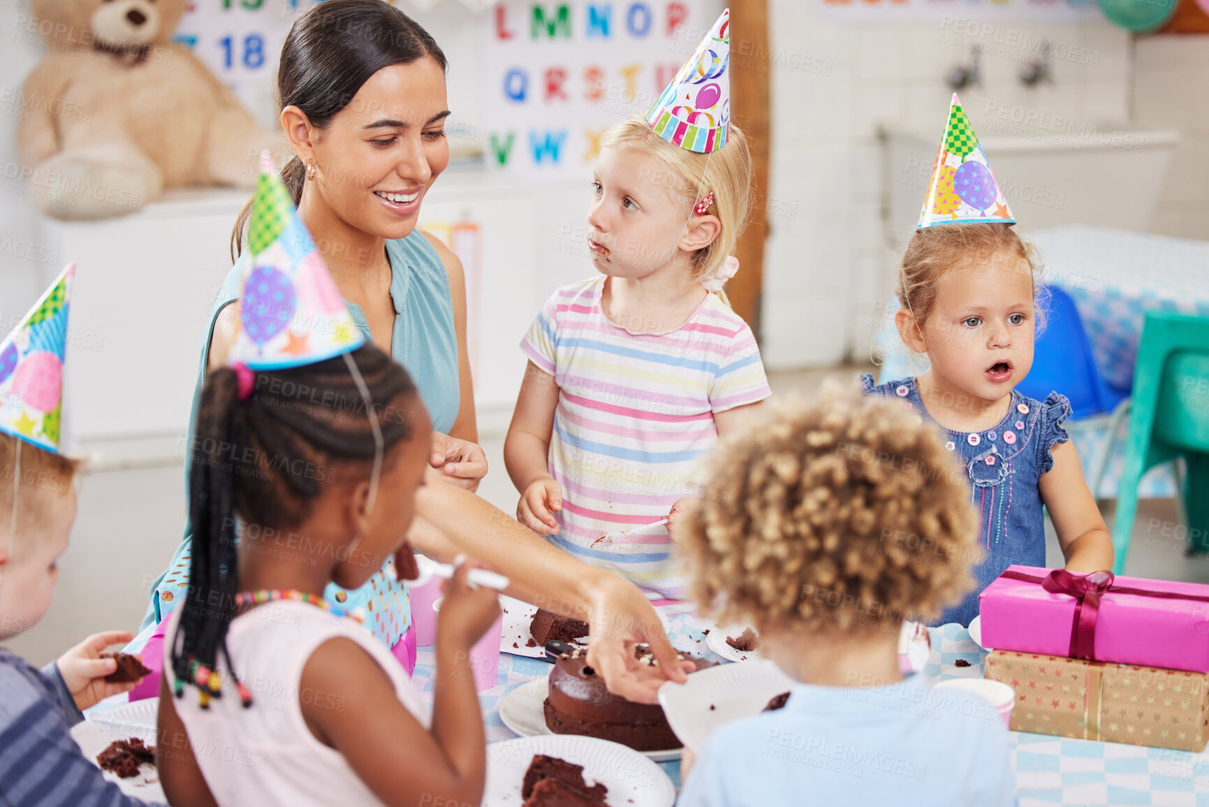 Buy stock photo Shot of a preschool children celebrating a birthday in class